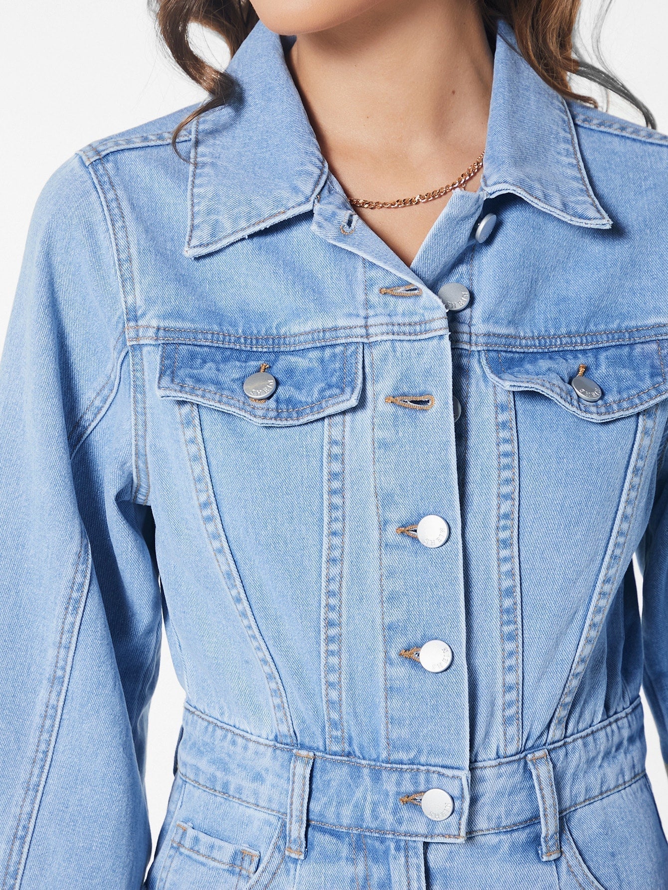 Blues jumpsuit with flap pocket made of denim with button closure at the front