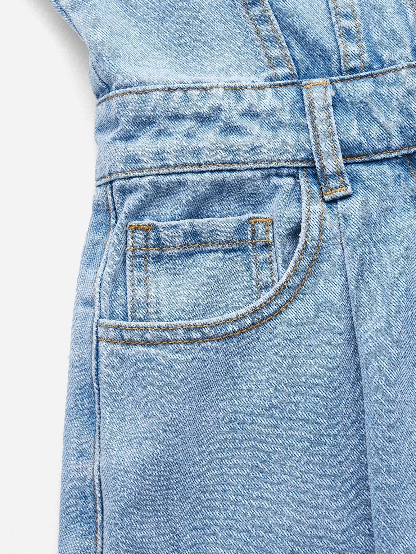 Blues jumpsuit with flap pocket made of denim with button closure at the front