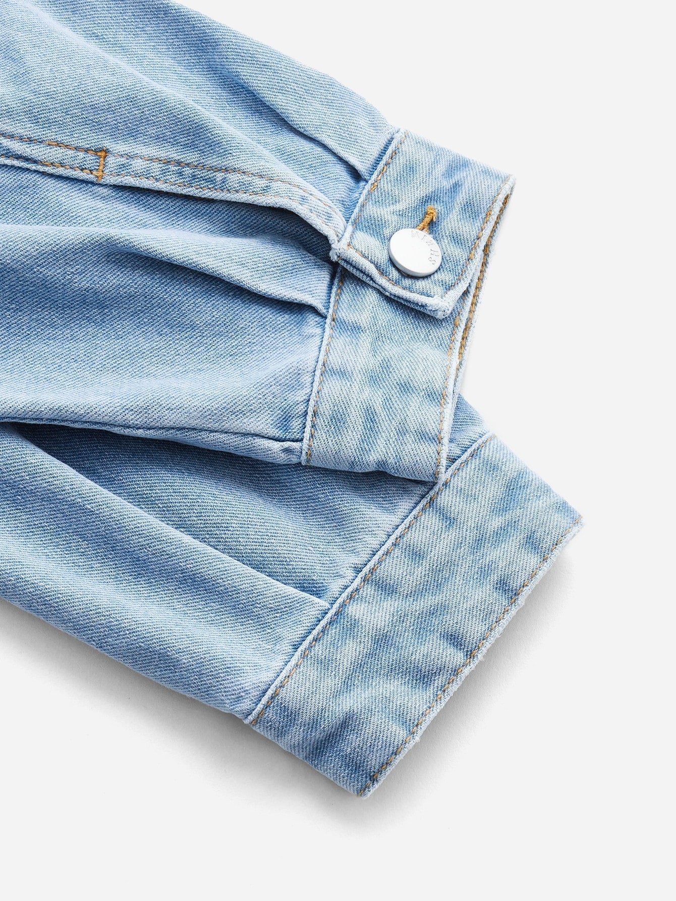 Blues jumpsuit with flap pocket made of denim with button closure at the front