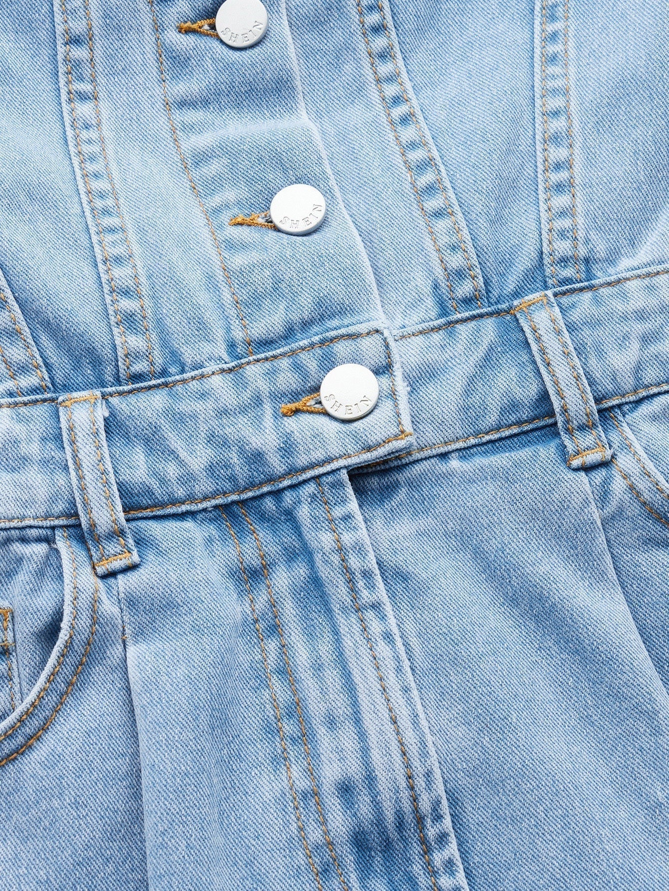 Blues jumpsuit with flap pocket made of denim with button closure at the front