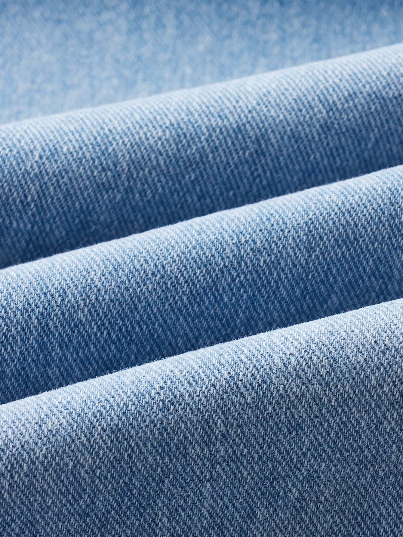 Blues jumpsuit with flap pocket made of denim with button closure at the front