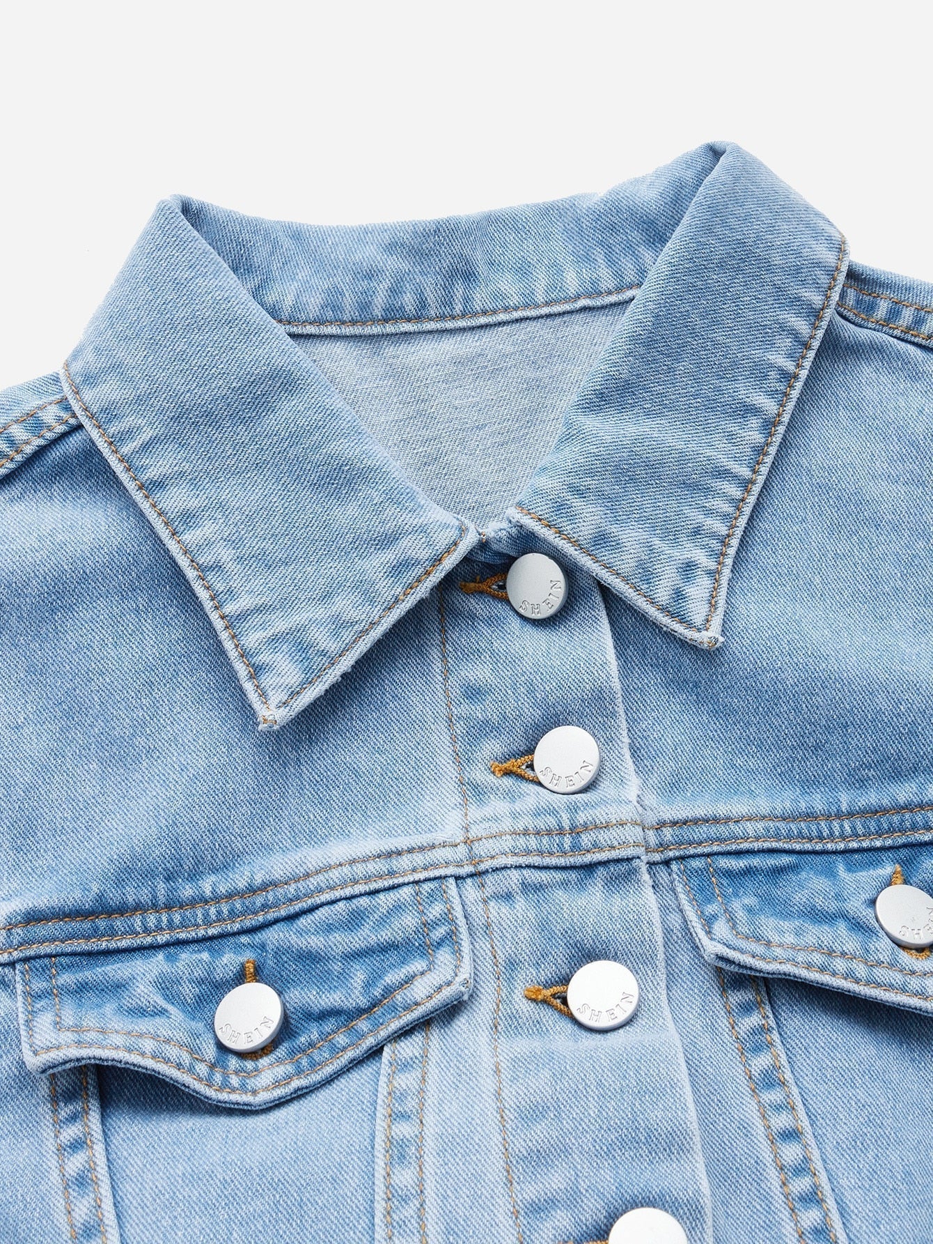 Blues jumpsuit with flap pocket made of denim with button closure at the front