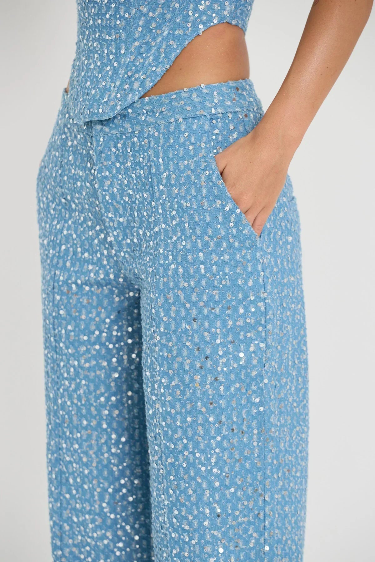 Blue tube top with sequins and wide leg pants with glitter