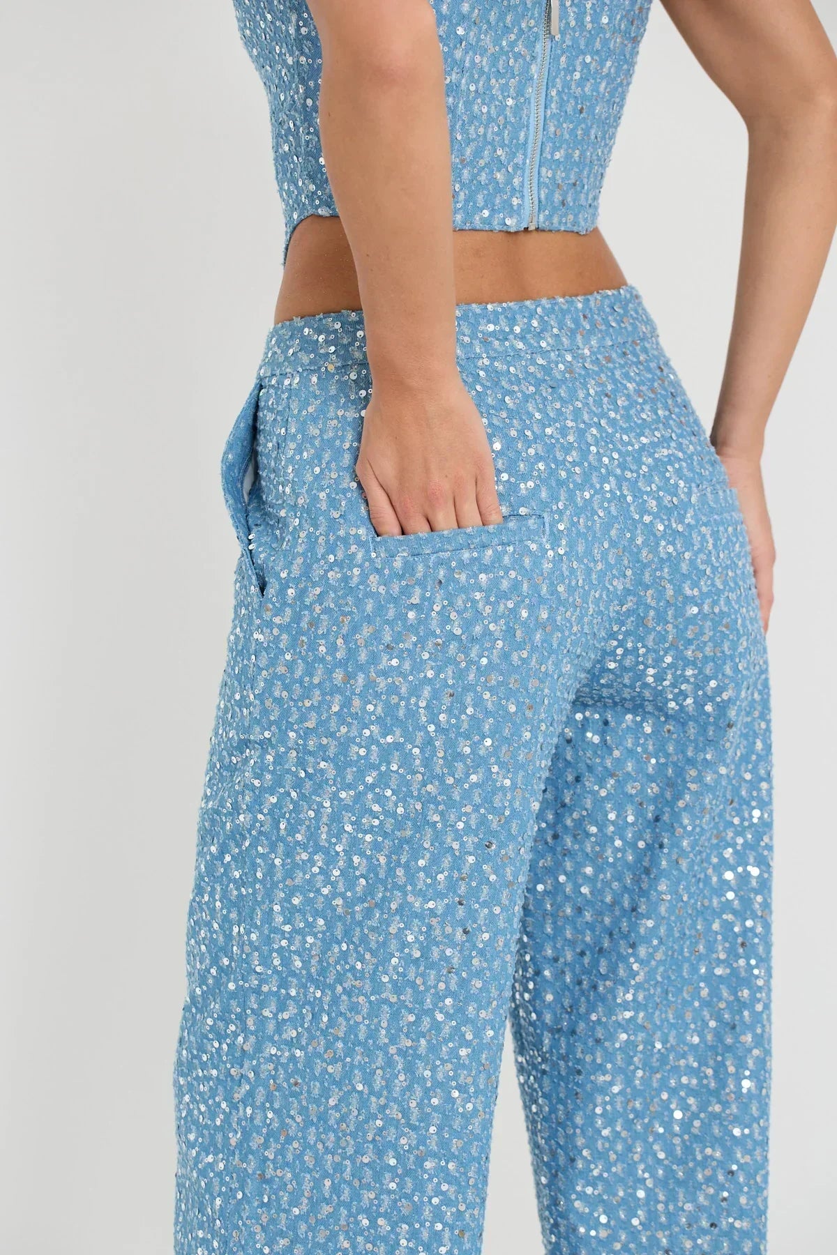 Blue tube top with sequins and wide leg pants with glitter