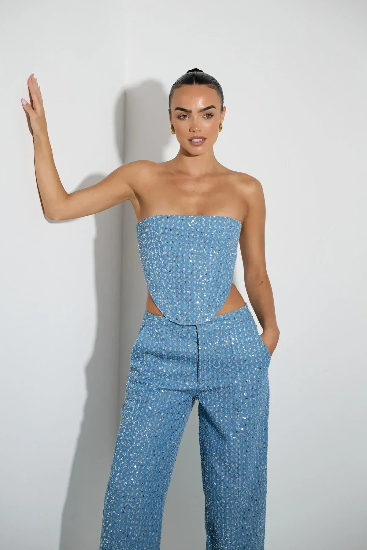 Blue tube top with sequins and wide leg pants with glitter