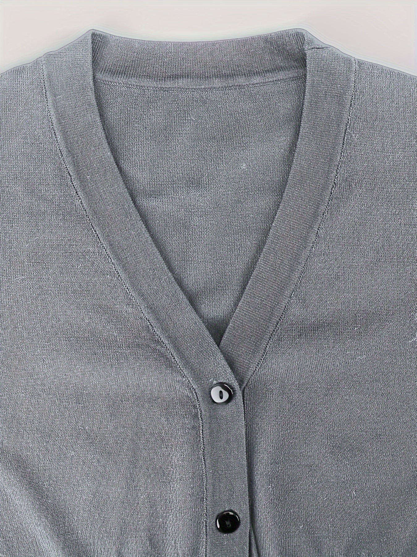 Bolero cardigan with button closure