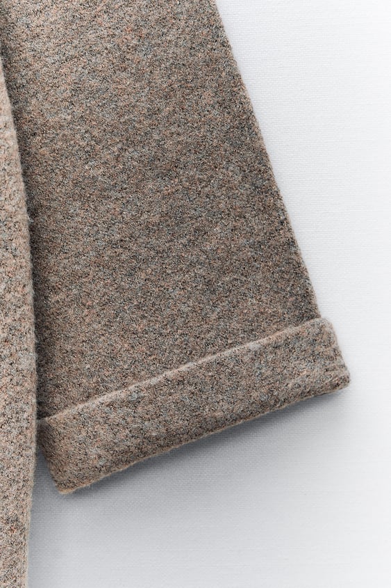 Short knitted coat with scarf