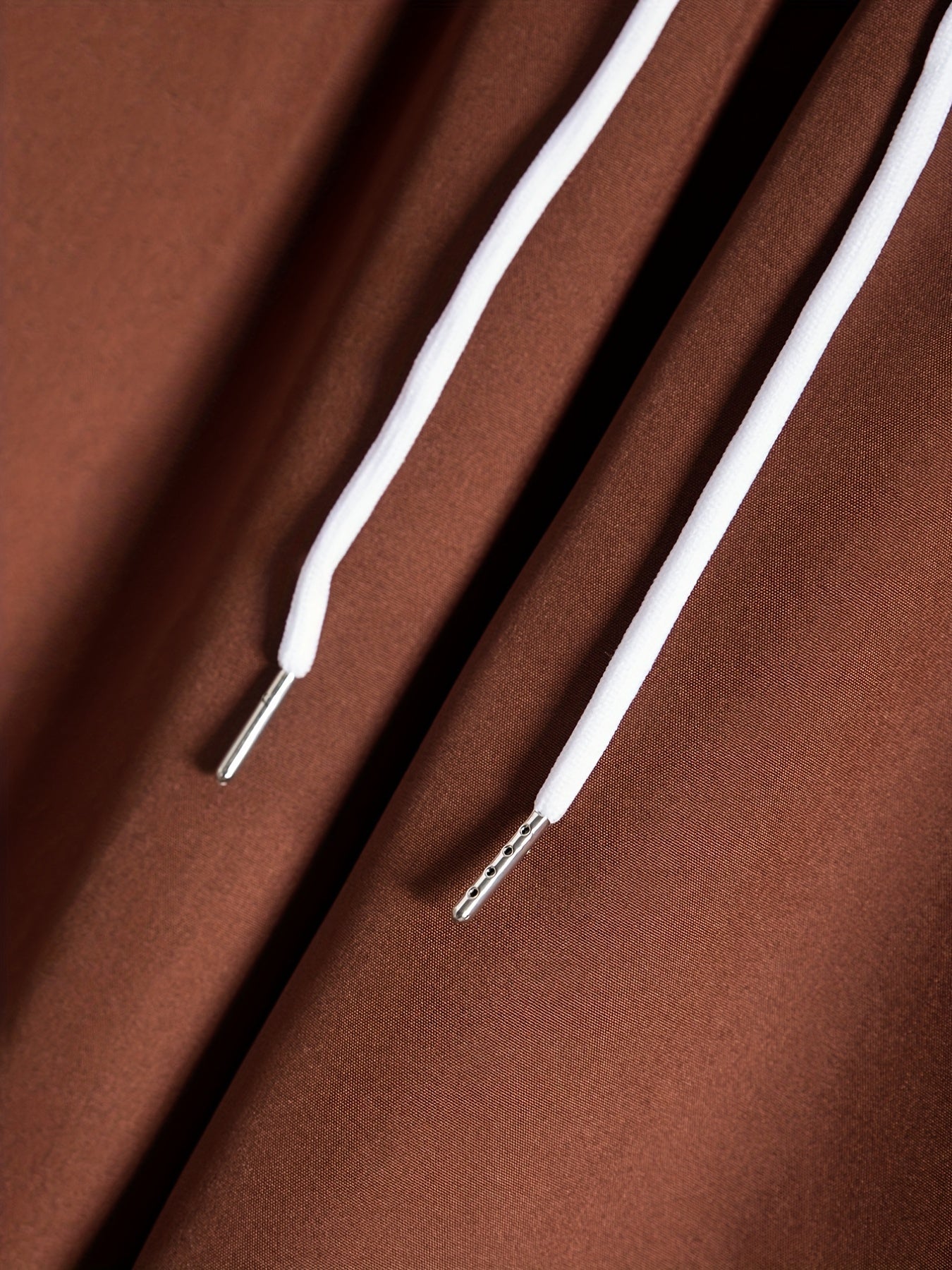 Set consisting of a short-sleeved shirt with lapel collar and buttons and shorts with drawstring