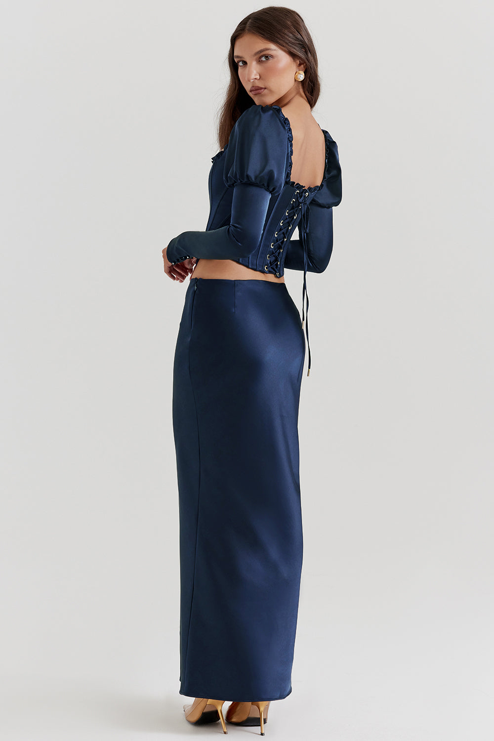 Navy blue corset with puff sleeves and satin maxi skirt with bias cut