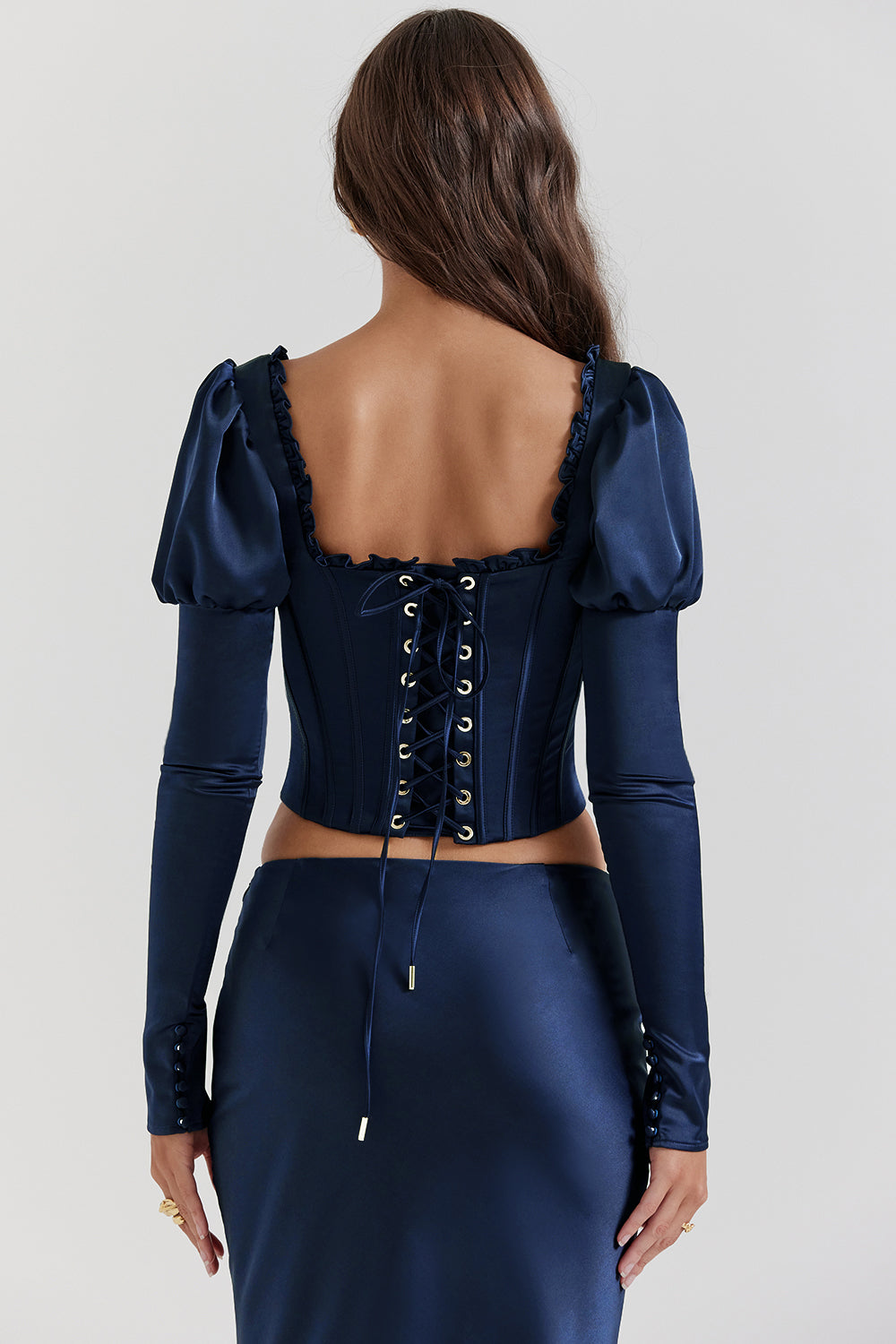 Navy blue corset with puff sleeves and satin maxi skirt with bias cut