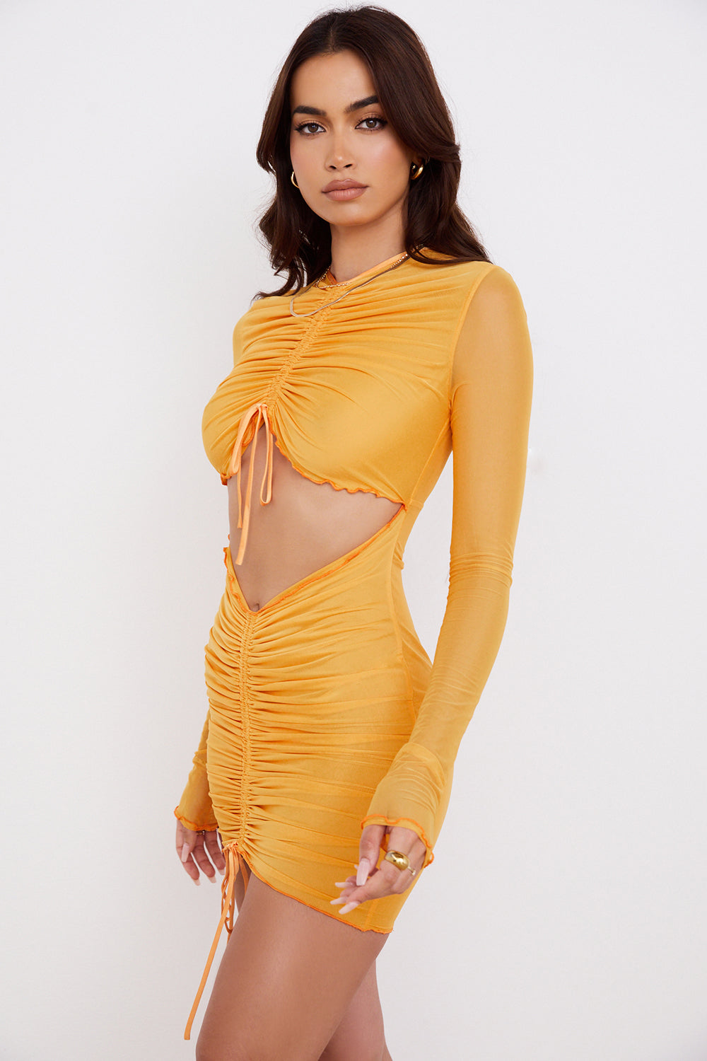 Orange mesh mini dress with long sleeves and cut out with ruffles