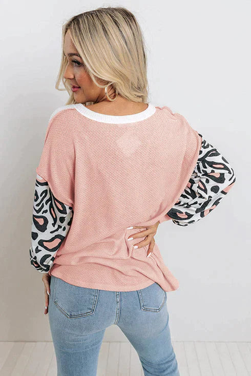 Patchwork waffle knit top with leopard sleeves
