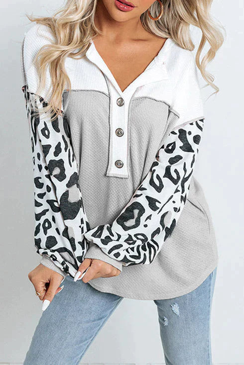 Patchwork waffle knit top with leopard sleeves