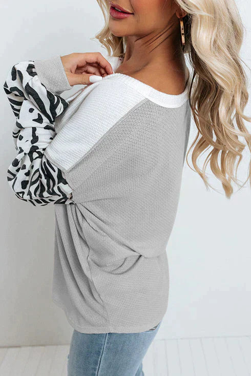 Patchwork waffle knit top with leopard sleeves