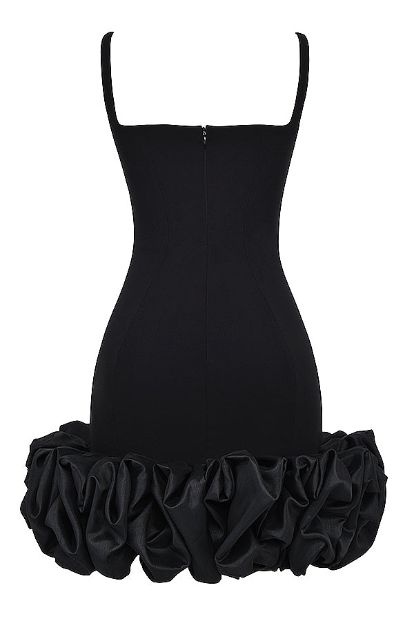 Black dress with ruffles at the hem